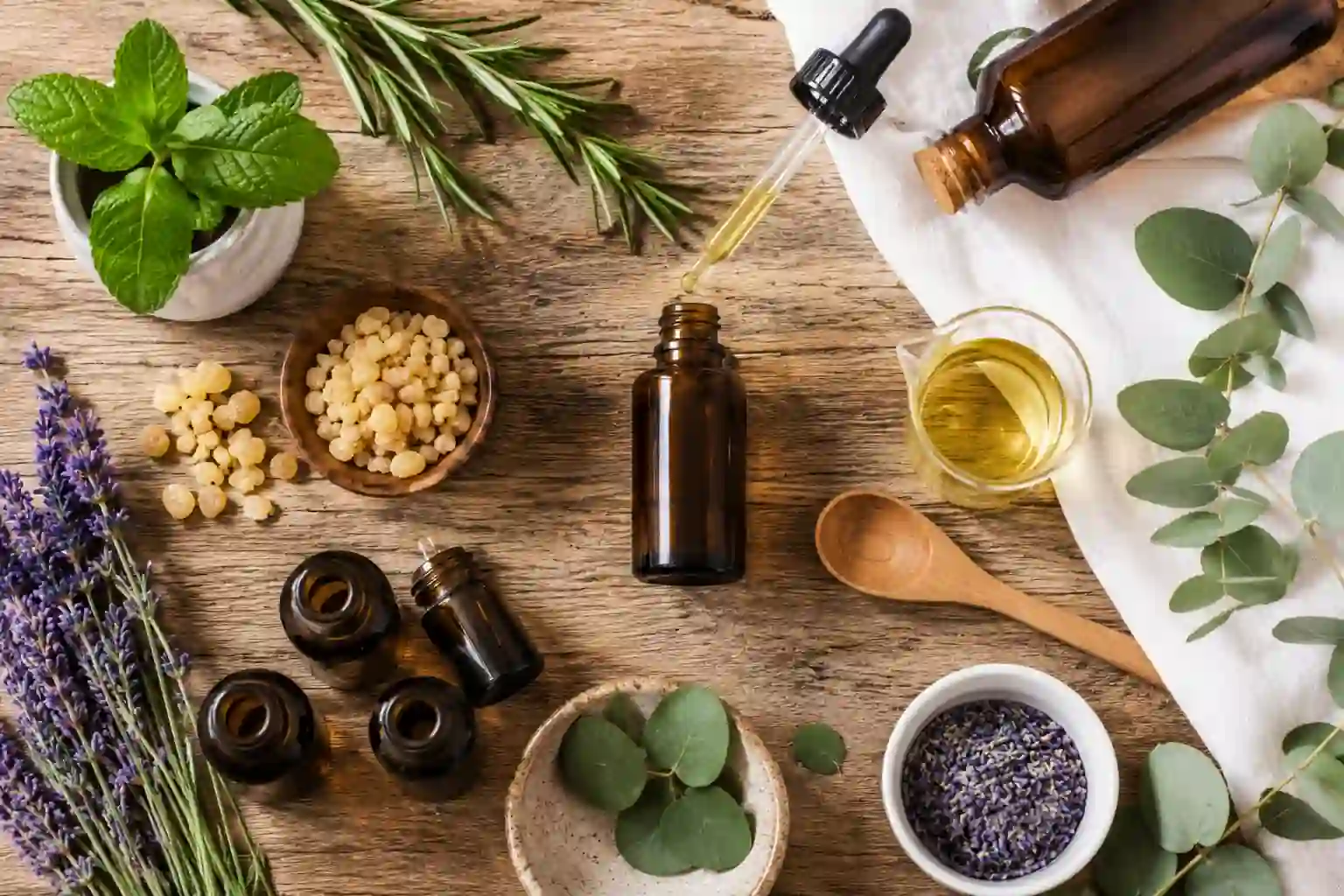 DIY muscle pain relief essential oil blend recipe made with peppermint, lavender, rosemary, eucalyptus, frankincense, and carrier oil.